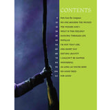 The image shows a table of contents from a "Wicked" musical theater songbook. On the left is a dramatic photo of hands gripping a broomstick against a purple-blue background, iconic to the show. On the right, a green page lists 13 songs with page numbers, including "No One Mourns the Wicked," "The Wizard and I," "Popular," "Defying Gravity," and "For Good." The book contains over 100 pages of sheet music.