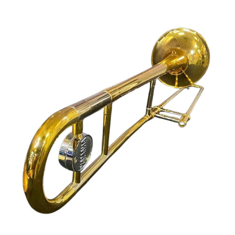 The image shows a brass slide trombone with a shiny golden finish against a white background. Key features include the large bell, long tubing, dual-slide mechanism, mouthpiece receiver, and a tuning slide or water key. This classic tenor trombone, commonly used in bands and orchestras, appears well-maintained and in good condition.